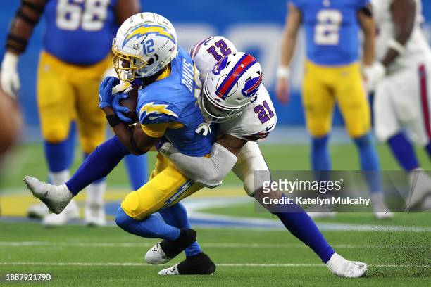 Jordan Poyer of the Buffalo Bills tackles Derius Davis of the Los Angeles Chargers during the fourth quarter at SoFi Stadium on December 23, 2023 in...