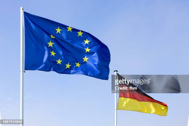 eu- and german national flags with blue sky - french parliament stock pictures, royalty-free photos & images