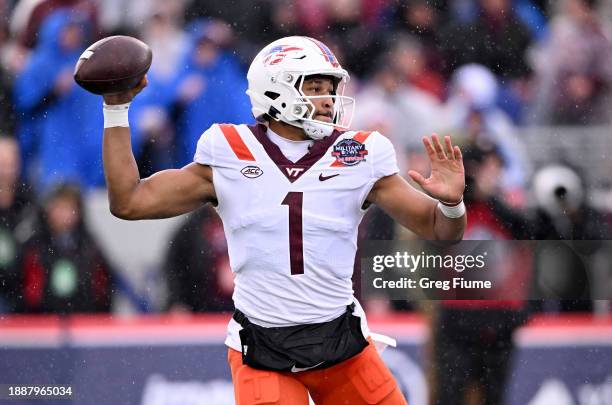 Kyron Drones of the Virginia Tech Hokies throws a pass in the first quarter against the Tulane Green Wave during the Military Bowl presented by...