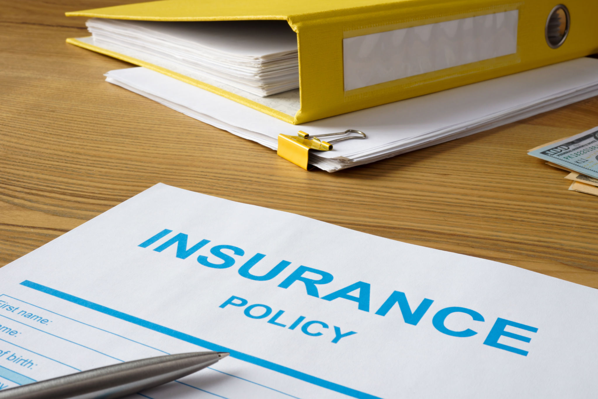 Insurance policy with pen and folder. Insurance policy with pen and folder.