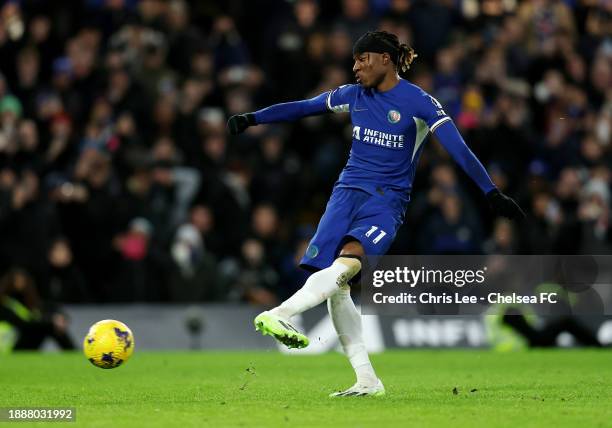 Noni Madueke of Chelsea scores their team's second goal from the penalty spot during the Premier League match between Chelsea FC and Crystal Palace...