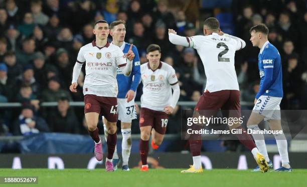 Phil Foden of Manchester City celebrates after scoring their first goal during the Premier League match between Everton FC and Manchester City at...