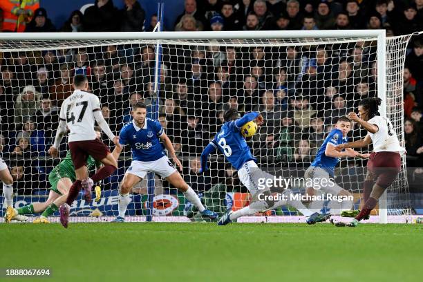 Amadou Onana of Everton commits handball to concede a penalty during the Premier League match between Everton FC and Manchester City at Goodison Park...
