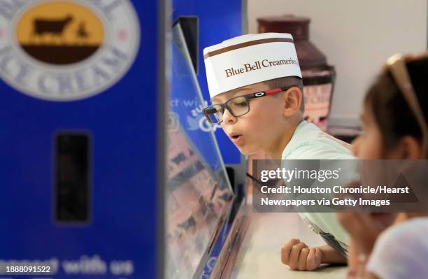 Luke Ramirez of College Station, looks at the flavors in the ice cream parlor at Blue Bell Creameries, 1101 South Blue Bell Rd., on Tuesday, July 18,...