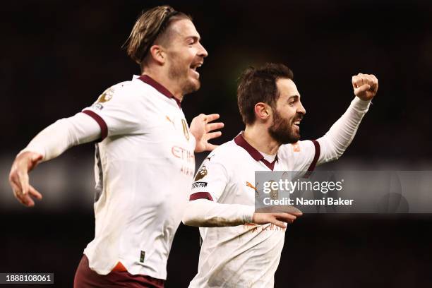 Bernardo Silva of Manchester City celebrates with Jack Grealish of Manchester City after scoring their sides third goal during the Premier League...