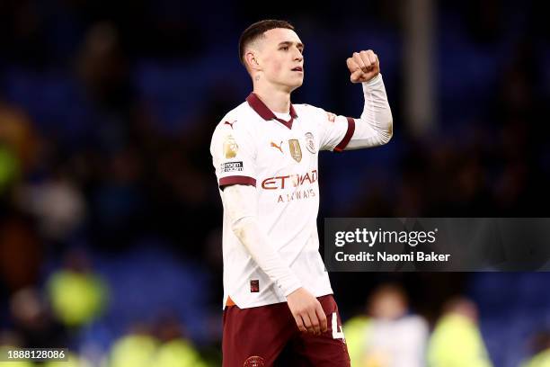Phil Foden of Manchester City celebrates victory at full-time following the Premier League match between Everton FC and Manchester City at Goodison...