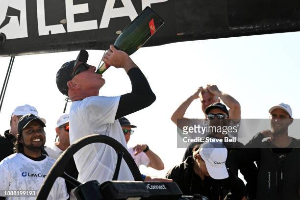 LawConnect crew celebrate after winning line honours during the 2023 Sydney to Hobart, on December 28, 2023 in Hobart, Australia.