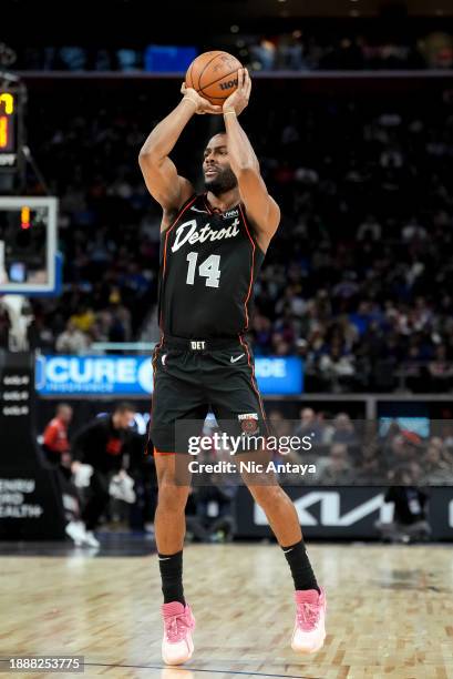 Alec Burks of the Detroit Pistons shoots the ball against the Brooklyn Nets at Little Caesars Arena on December 26, 2023 in Detroit, Michigan. NOTE...