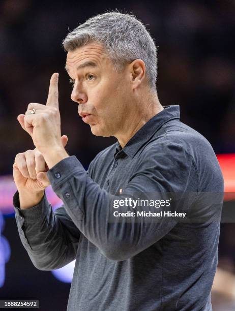 Head coach Tony Bennett of the Virginia Cavaliers signals to his players during the first half against the Notre Dame Fighting Irish at Joyce Center...