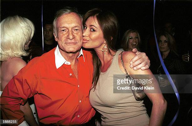 Playboy publisher Hugh Hefner and former Playboy playmate Ava Fabian arrive at Hefner's 77th birthday party at Barfly March 30, 2003 in West...