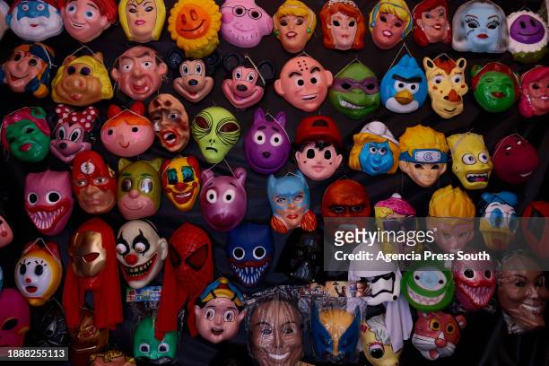 Masks are exhibited for sale ahead New Year's celebration on December 30, 2023 in Quito, Ecuador. The figures are know as "Años Viejos" or...