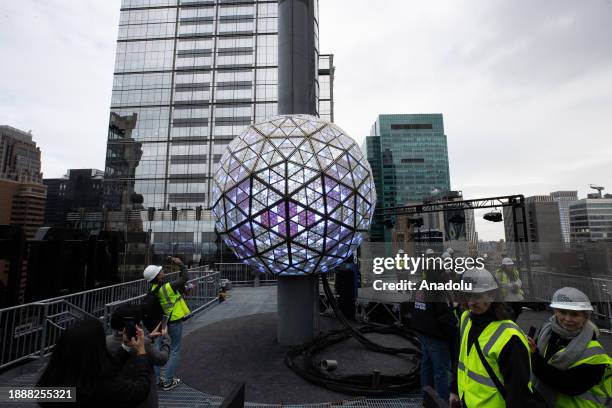 View of the world-famous Times Square crystal ball is illuminated and raised for testing the day before New Year's Eve celebrations in New York City,...