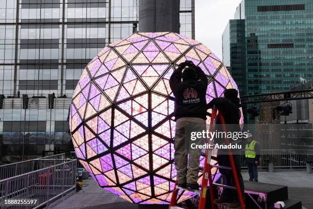View of the world-famous Times Square crystal ball is illuminated and raised for testing the day before New Year's Eve celebrations in New York City,...
