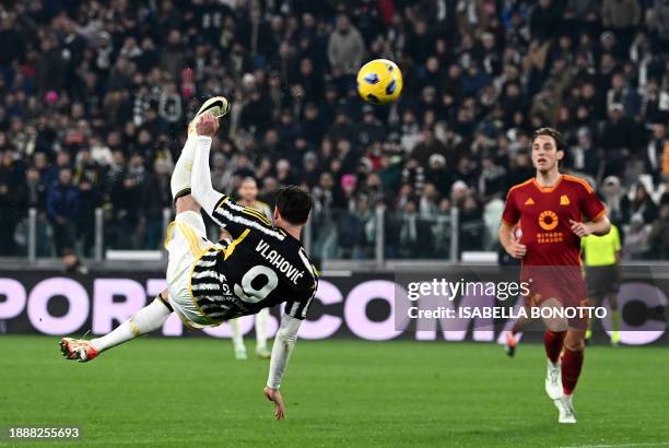 Juventus' Serbian forward Dusan Vlahovic performs an overhead kick as he shoots towards goal during the Italian Serie A football match between...
