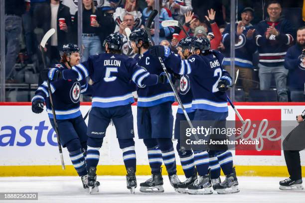 Mason Appleton, Brenden Dillon, Adam Lowry, Nino Niederreiter and Dylan DeMelo of the Winnipeg Jets celebrate a first period goal against the...