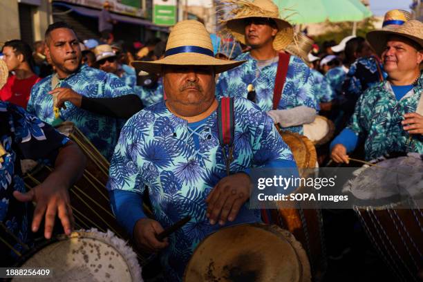 People are seen playing tambours during the San Benito celebrations in the town center. The San Benito festival is celebrated in Cabimas within the...