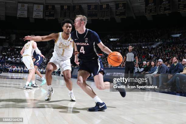 Virginia Cavaliers guard Andrew Rohde drives to the basket against Notre Dame Fighting Irish guard Julian Roper II on December 30 at the Purcell...