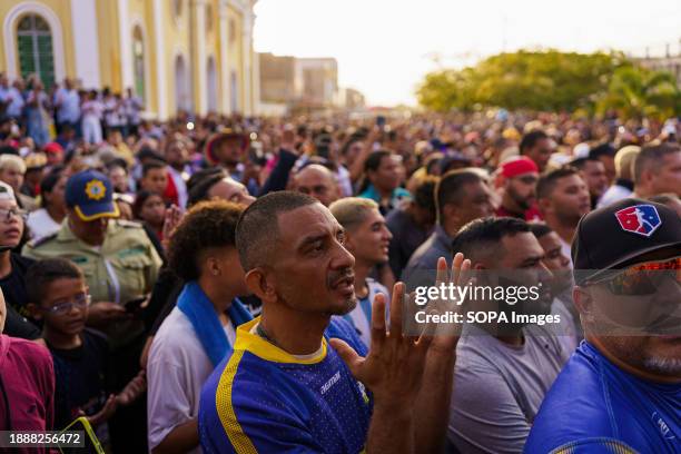 Man is seen praying during the festivity of San Benito. The San Benito festival is celebrated in Cabimas within the Zulia state every December 27th....