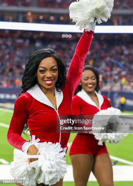 Houston Texans cheerleader entertains fans during the NFL game between the Cleveland Browns and Houston Texans at NRG Stadium on December 24, 2023 in...