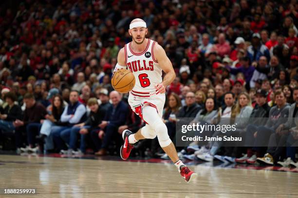 Alex Caruso of the Chicago Bulls controls the ball against the Atlanta Hawks on December 26, 2023 at United Center in Chicago, Illinois. NOTE TO...