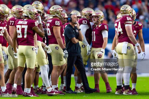 Florida State head coach Mike Norvell along the sidelines with a host of Seminoles players in the first half against Georgia during the 90th annual...