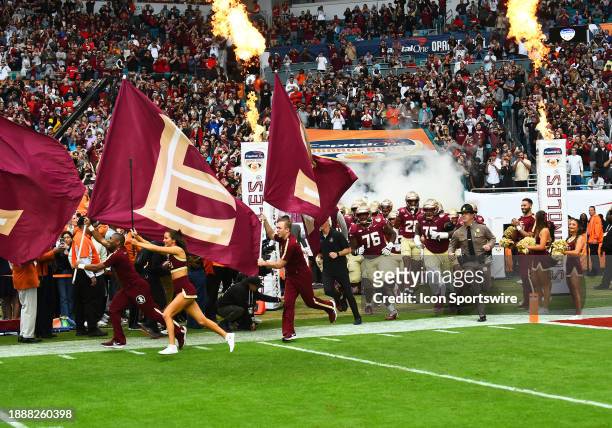 The Florida State Seminoles sprint onto the field prior to the Capital One Orange Bowl between the Georgia Bulldogs and the Florida State Seminoles...