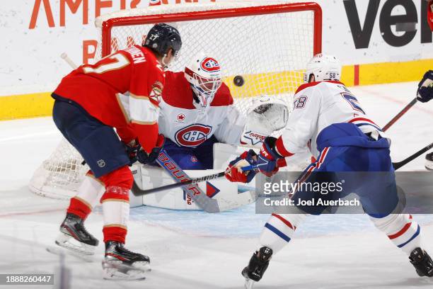 Eetu Luostarinen of the Florida Panthers shoots and scores against Goaltender Jake Allen of the Montreal Canadiens during the third period at the...