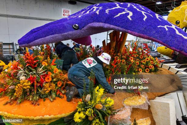Volunteers put finishing touches on Cal Poly Universities float for Rose Parade floats Rosemont Pavilion on Saturday, Dec. 30, 2023 in Pasadena, CA.