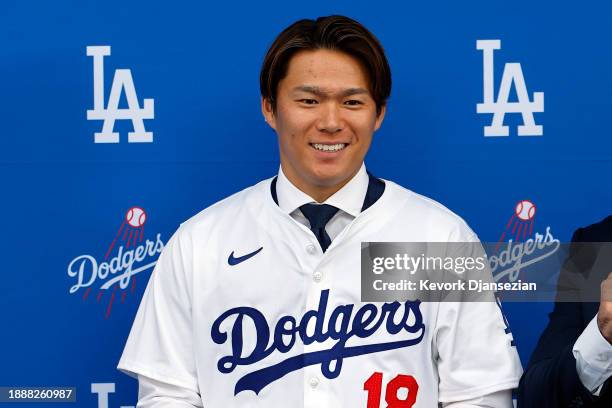 Yoshinobu Yamamoto speaks to the media during an introductory press conference at Dodger Stadium on December 27, 2023 in Los Angeles, California.