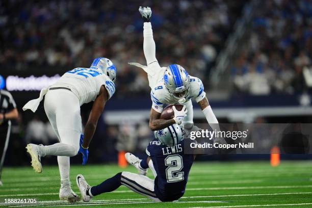 Jameson Williams of the Detroit Lions runs with the ball against the Dallas Cowboys during the first half at AT&T Stadium on December 30, 2023 in...