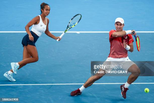 Canada's Steven Diez and Leylah Fernandez play a point against Chile's Tomas Barrios Vera and Daniela Seguel during their mixed-doubles match at the...