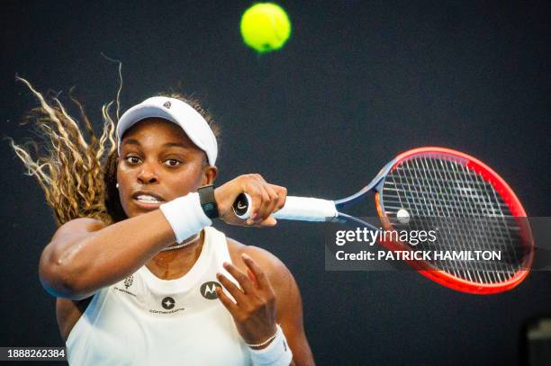 S Sloane Stephens hits a return during her women's singles match against Czech Republic's Katerina Siniakova at the Brisbane International tennis...