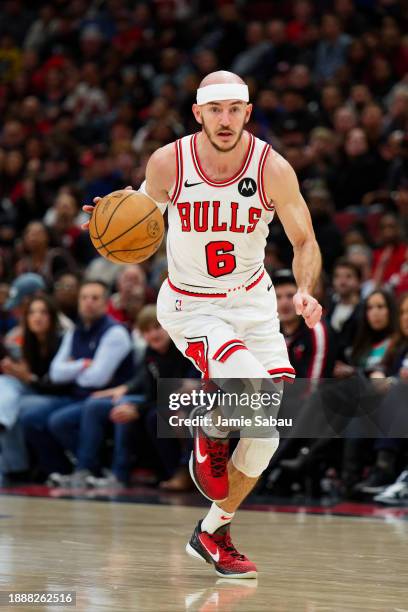 Alex Caruso of the Chicago Bulls controls the ball against the Atlanta Hawks on December 26, 2023 at United Center in Chicago, Illinois. NOTE TO...