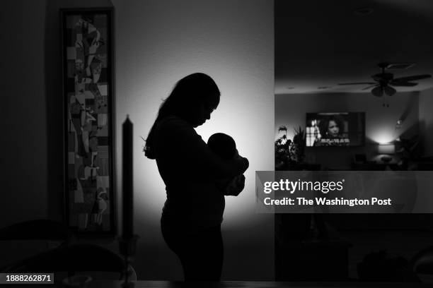 Mother, who does not want to be named, holds her baby, who was born in December of 2022, at their home on February 2 in Houston, TX. The mother and...