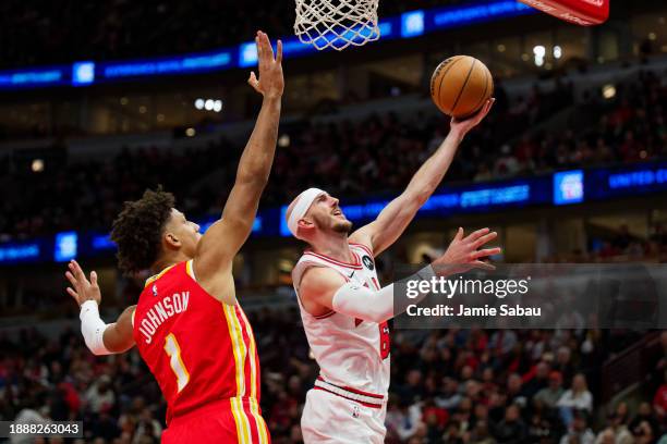 Alex Caruso of the Chicago Bulls controls the ball against the Atlanta Hawks on December 26, 2023 at United Center in Chicago, Illinois. NOTE TO...