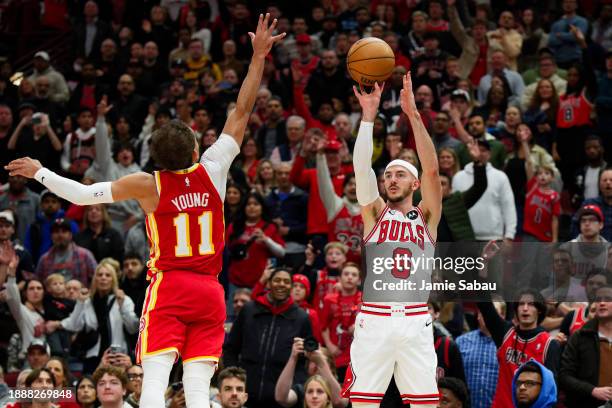 Alex Caruso of the Chicago Bulls controls the ball against the Atlanta Hawks on December 26, 2023 at United Center in Chicago, Illinois. NOTE TO...