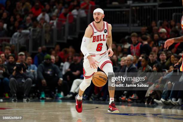 Alex Caruso of the Chicago Bulls controls the ball against the Atlanta Hawks on December 26, 2023 at United Center in Chicago, Illinois. NOTE TO...