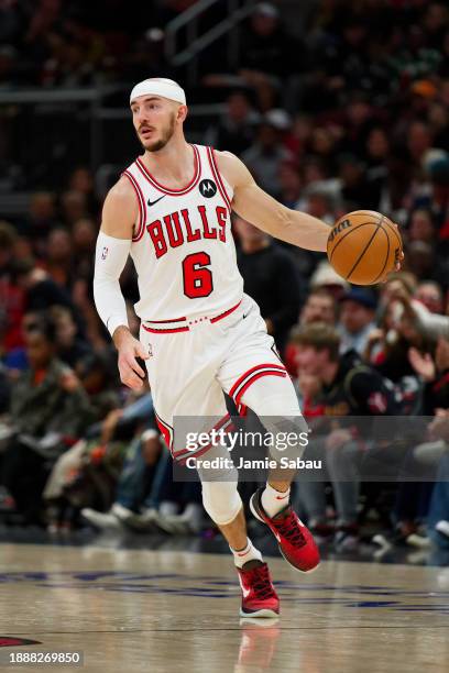 Alex Caruso of the Chicago Bulls controls the ball against the Atlanta Hawks on December 26, 2023 at United Center in Chicago, Illinois. NOTE TO...