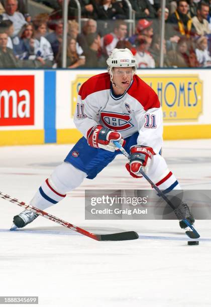 Saku Koivu of the Montreal Canadiens skates against the Toronto Maple Leafs during NHL game action on February 21, 2004 at Air Canada Centre in...