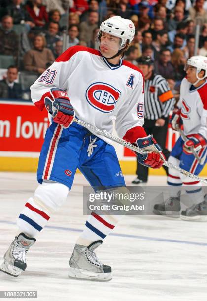 Joe Juneau of the Montreal Canadiens skates against the Toronto Maple Leafs during NHL game action on February 21, 2004 at Air Canada Centre in...