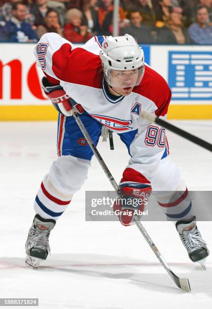 Joe Juneau of the Montreal Canadiens skates against the Toronto Maple Leafs during NHL game action on February 21, 2004 at Air Canada Centre in...