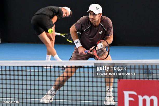 Britain' Andy Murray reacts to a shot from his partner Holger Rune of Denmark during their men's doubles match against Russian duo Aslan Karatsev and...