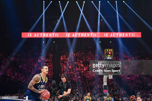 Fans and Edwin JACKSON of ASVEL competes in the Champion 3 points shootout during the All Star Game at AccorHotels Arena on December 30, 2023 in...