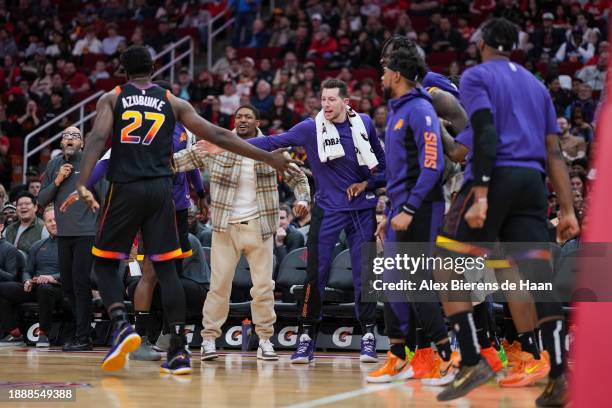 The Phoenix Suns bench reacts after Udoka Azubuike of the Phoenix Suns scores during the second quarter of the game against the Houston Rockets at...