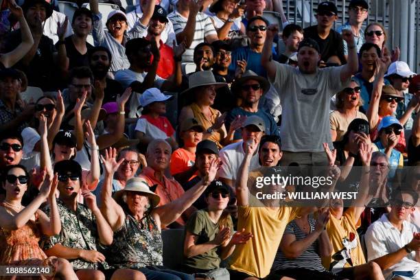 Fans cheer on Britain's Andy Murray and partner Holger Rune of Denmark during their men's doubles match against Russian duo Aslan Karatsev and Roman...