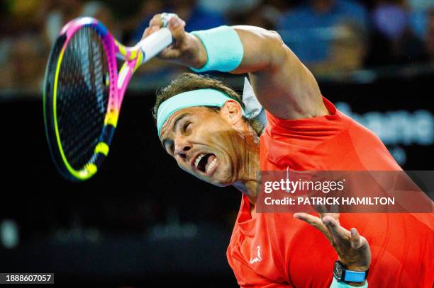 Spain's Rafael Nadal and partner Marc Lopez serve against Australia's Max Purcell and Jordan Thompson during their men's doubles match at the...