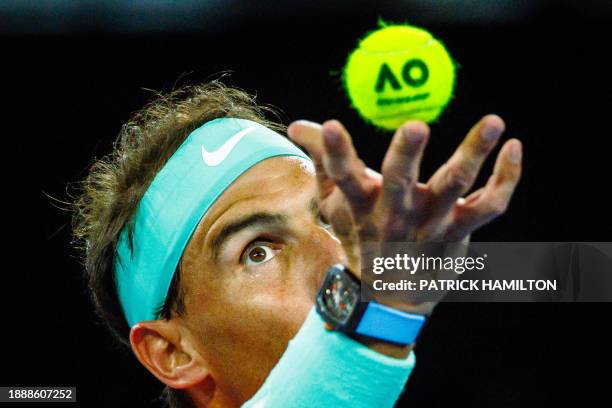 Spain's Rafael Nadal and partner Marc Lopez serve against Australia's Max Purcell and Jordan Thompson during their men's doubles match at the...