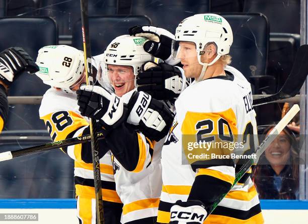Valtteri Puustinen of the Pittsburgh Penguins scores his first NHL goal against the New York Islanders at 9:48 of the third period at UBS Arena on...