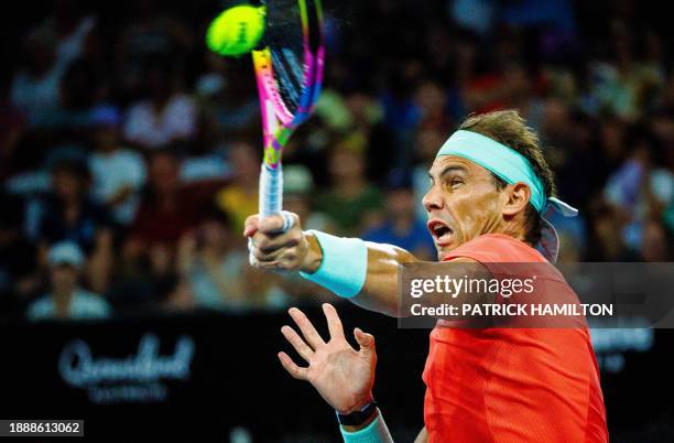 Spain's Rafael Nadal and partner Marc Lopez hit a return against Australia's Max Purcell and Jordan Thompson during their men's doubles match at the...