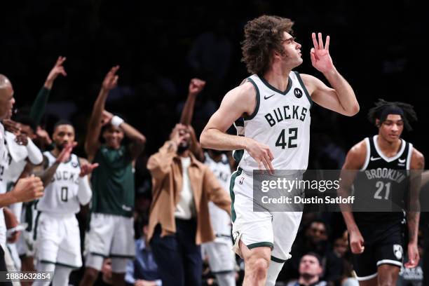 Robin Lopez of the Milwaukee Bucks reacts after making a three pointer during the fourth quarter against the Brooklyn Nets at Barclays Center on...